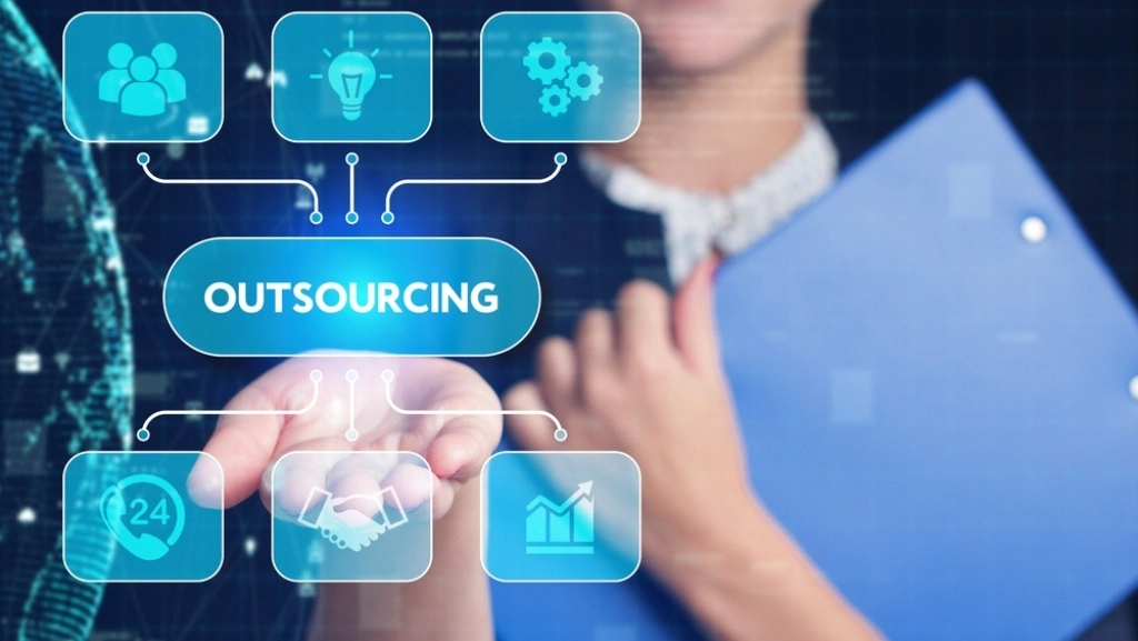 Woman using a tablet for software development outsourcing services
