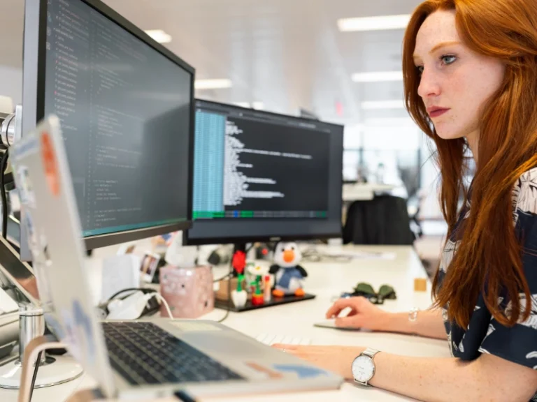 Offshore software developer working at a desk computer