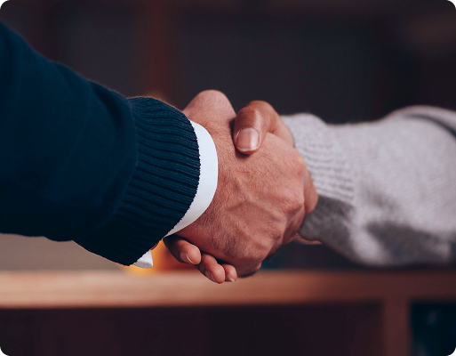 Business handshake representing client partnership in custom software development