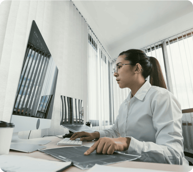 Business analyst working on a computer in a modern office