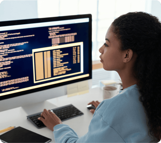 Software engineer working on application development at a workstation